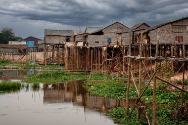 Poor Cambodians living in poverty along a river in South East Asia