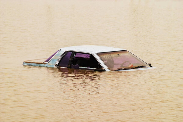 Rural Country Road leading into flood waters in Rural America, North America