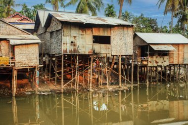 Poor Cambodians living in poverty along a river in South East Asia