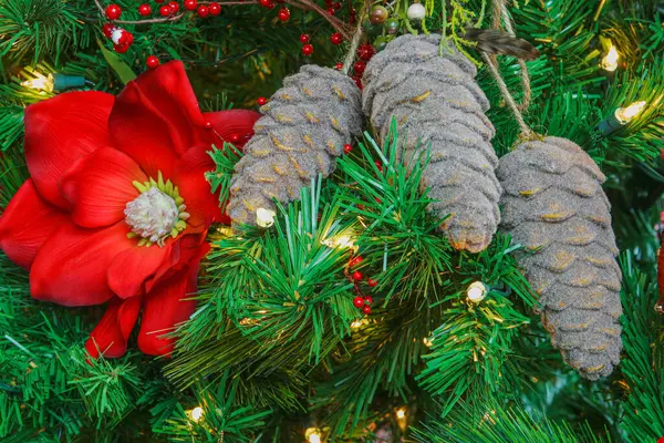 Christmas Tree Decorations Pine Cones Red Flower Lights Copy Space — Stock Photo, Image