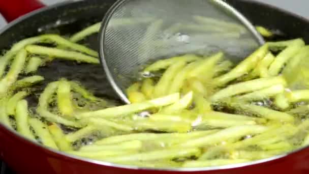 Close Woman Deep Frying French Fries Red Skillet Kitchen — Stock Video