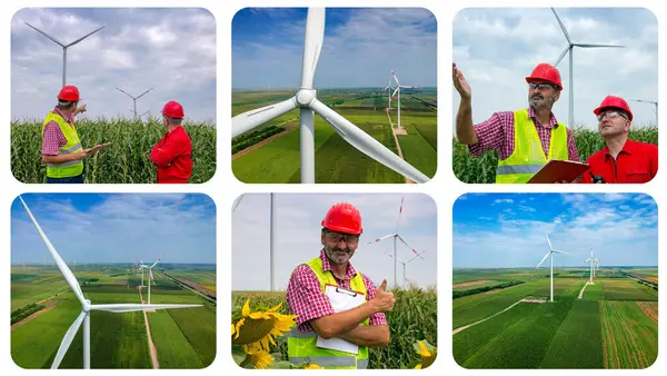 持続可能な風力エネルギー 風力発電所 ハードハットの女性と男性がブルースカイに親指を示しています ウィンドファームに立っているクリップボードと笑顔の労働者 Wind Farmでスマートフォンを使用したマネージャー ロイヤリティフリーのストック写真