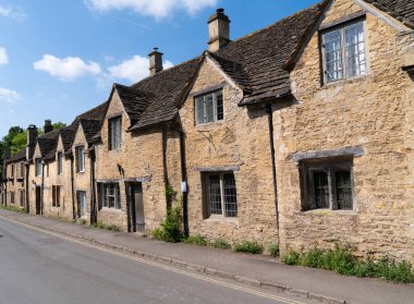 Street in Castle Combe pretty village in Wiltshire within the Cotswolds Area of Natural Beauty near Chippenham England UK clipart