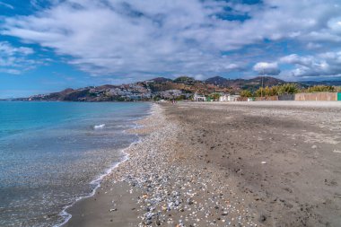 Nerja Playa de Playazo Chucho beach Costa del Sol Spain Andalusia blue mediterranean sea and waves clipart