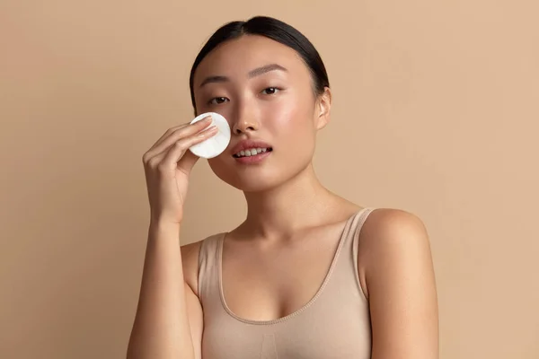 Woman Cleaning Face With White Pad. Beautiful Girl Removing Makeup White Cosmetic Cotton Pad. Happy Female Taking Off Makeup From Facial Skin With Cosmetic Pad. Hight Quality Image