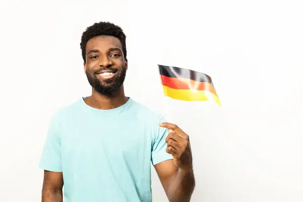 Portrait Smiling African American Man Proudly Holding German Flag Isolated — Stock Photo, Image