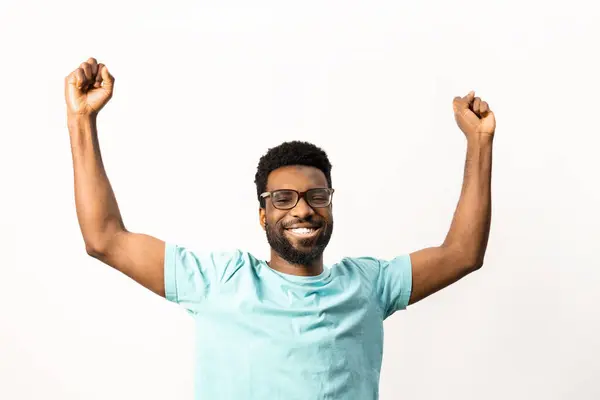 African American Man Glasses Raises His Fists Triumphant Cheer Expressing — Stock Photo, Image