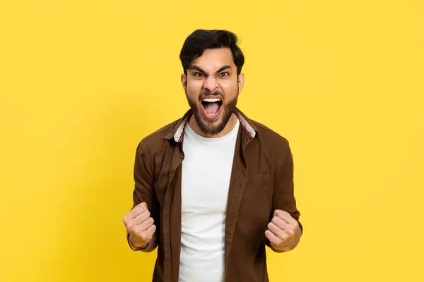 Excited Young Man Celebrating Success Yellow Background Positive Emotion Triumph — Stock Photo, Image