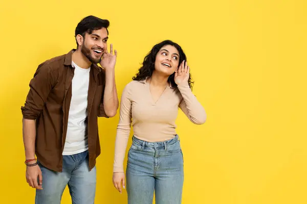 Young Man Whispering Secret Excited Woman Yellow Background Concept Surprise — Stok Foto