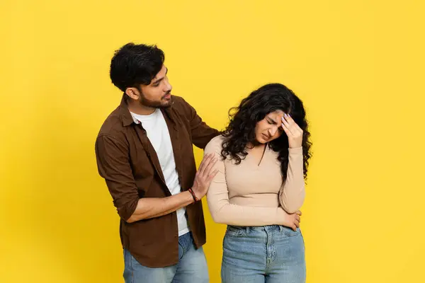 Man Comforting Upset Woman Yellow Background Relationship Support Consoling Empathy — Stock Photo, Image
