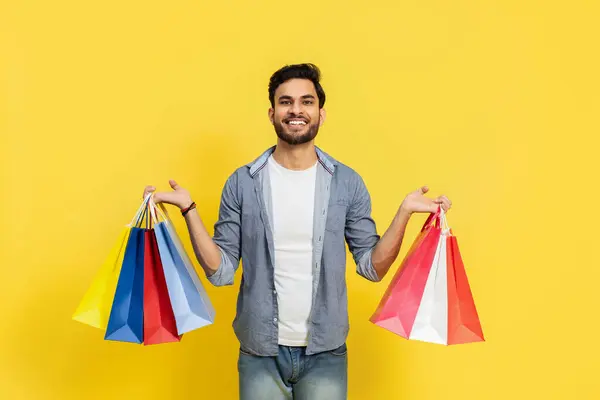 Smiling Man Holding Shopping Bags Yellow Background Happy Customer Sale — Stok Foto