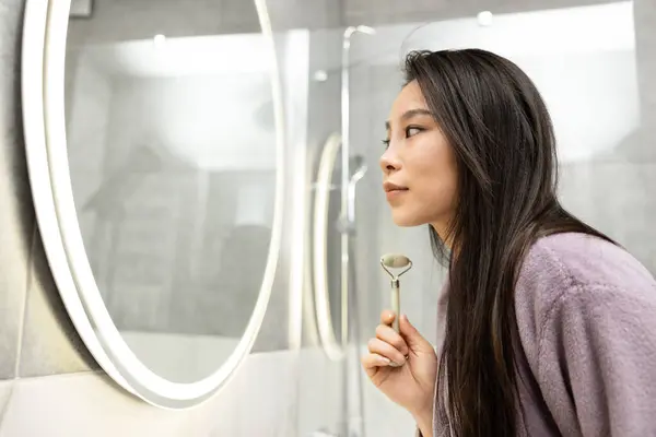 Woman Bathrobe Enjoying Skincare Routine Facial Massager Illuminated Mirror — Stock Photo, Image