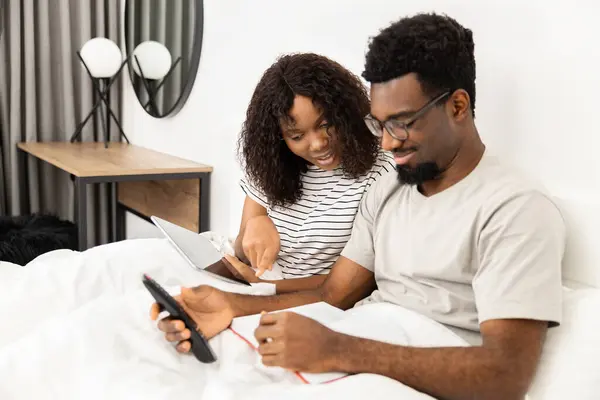 Couple Enjoying Leisure Time Bedroom Tablet Book Royalty Free Stock Images