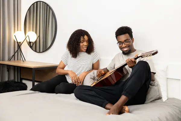 Casual Couple Enjoying Guitar Music Cozy Bed Home —  Fotos de Stock