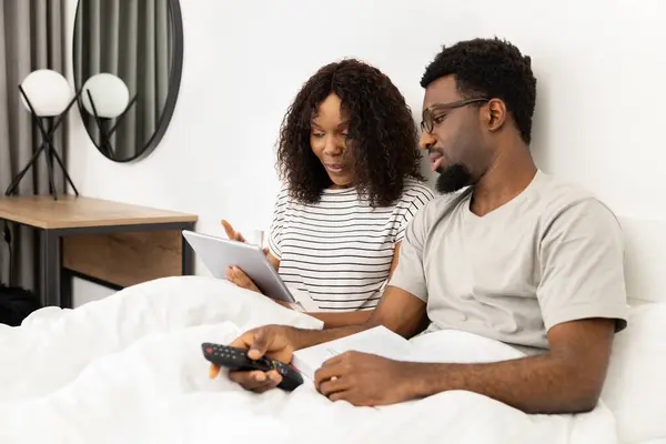 Couple Relaxing Bed Technology Book Enjoying Weekend Morning Together Modern Royalty Free Stock Images