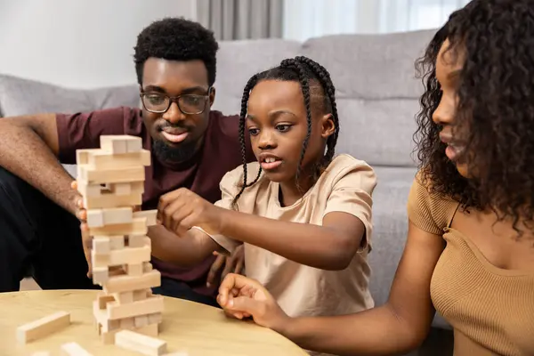 Family Enjoying Game Night Wooden Blocks Fun Indoor Activities Quality Royalty Free Stock Images