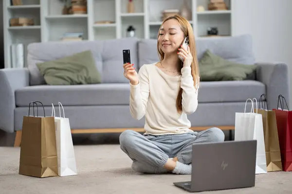 Young Woman Enjoying Online Shopping Sitting Cross Legged Laptop Colorful Stockfoto
