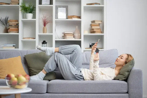 Young Woman Enjoying Online Shopping Sofa Cozy Home Interiors Comfortable Stock Photo
