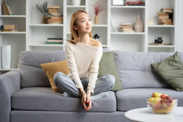 Young Woman Relaxing Sofa Modern Living Room Peaceful Comfortable Stylish Stock Image