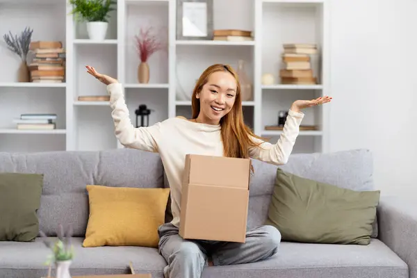 Happy Young Woman Unboxing Parcel Living Room Excited Female Sitting Stockbild