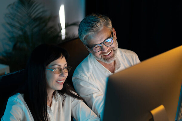 Two Colleagues Working Together Computer Office Smiling Collaborating Project Soft Royalty Free Stock Photos