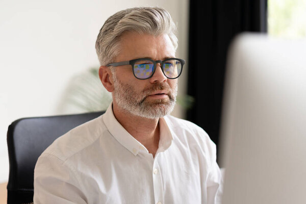 Focused Mature Man Glasses Working Computer Office Setting Business Professional Stock Image