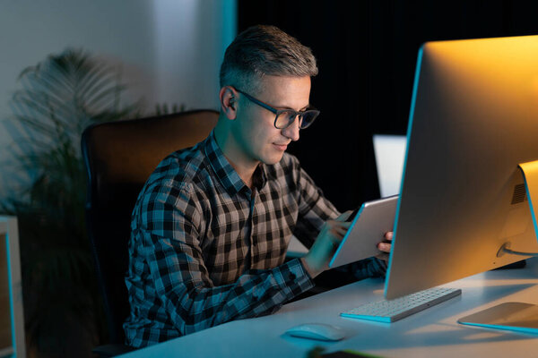 Professional Man Working Tablet Desktop Computer Office Night Royalty Free Stock Images