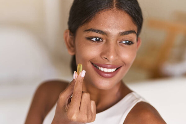 Diet And Nutrition. Radiant Woman Holding Vitamin Supplement. Promoting Healthy Lifestyle And Wellbeing With A Bright Smile. Ideal For Nutrition, Self-care, And Health-focused Campaigns.