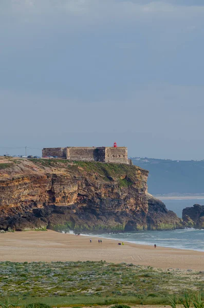 stock image Praia do Norte beach, cliffs and Nazare lighthouse cape. Portugal.