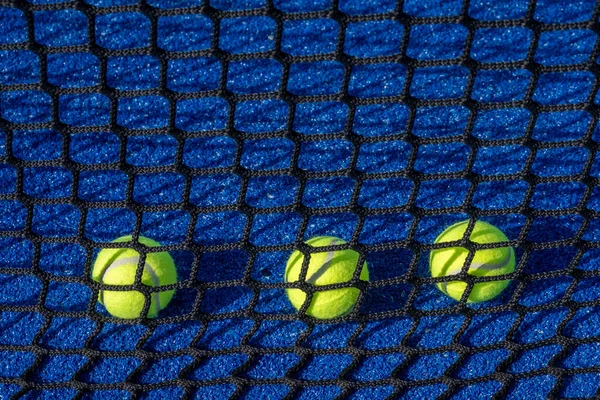 paddle tennis balls on a paddle tennis court