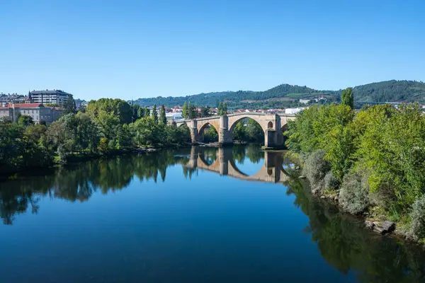 stock image river minho in the city of Ourense, old bridge
