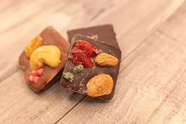 handmade chocolates made with chocolate, nuts and sugared fruit