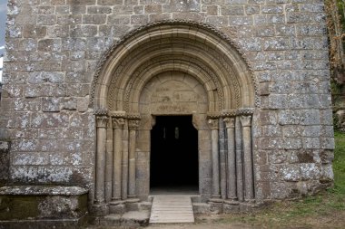 Door of the church of the medieval Romanesque monastery of Santa Cristina de Ribas de Sil. Ribeira Sacra, World Heritage Site in Galicia, Spain clipart