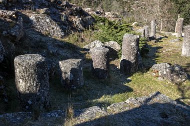 Granite roman milestones in Via XVIII, Roman road between Braga and Astorga. Baixa Limia-Serra do Xures Natural Park, Ourense. Galicia, Spain clipart