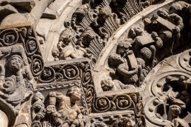 detail of the sculptures of the archivolts of the Ourense cathedral entrance. clipart