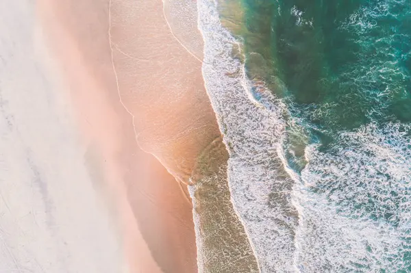 Overhead view aerial image from drone of an beautiful sea landscape beach with turquoise water with copy space for text.