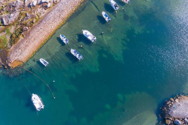 drone aerial top view of a small fishing boat harbor in Portugal clipart