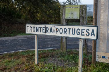 Signs indicating the border between Portugal and Spain in Calvos de Randin, Ourense. Spain. clipart