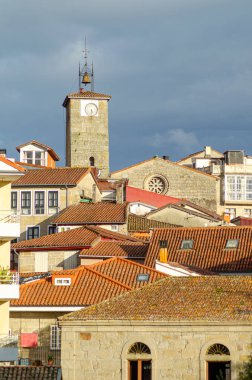 partial view of the village of Allariz at sunset. Galicia, Spain clipart