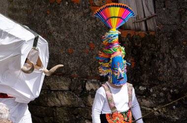 colored traditional masks of the carnival of Velilla de la Reina, called Antruejo, Castilla y Leon. Spain clipart