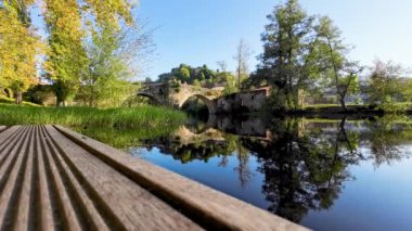 Arnoia river in Allariz, next to the medieval stone bridge on a sunny day. Ourense, Galicia. Spain