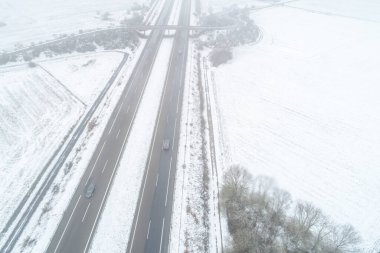 Drone view, A-52 highway after a snowfall in the region of A Limia, Ourense. Galicia, Spain