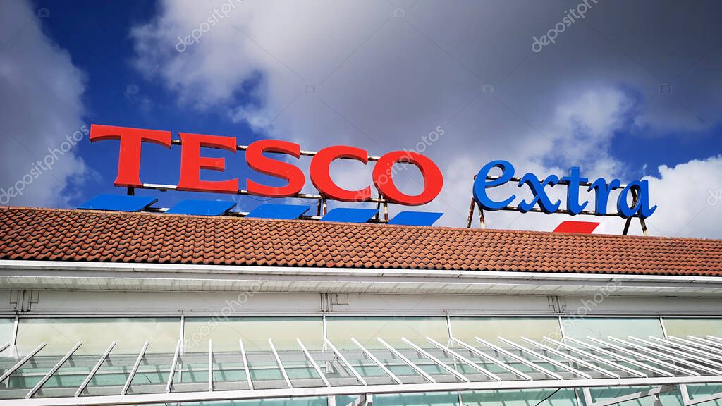 Llanelli, UK: September, 2018: Commercial signage of a Tesco Extra superstore. Tesco is a British multinational grocery and general merchandise retailer it is the third-largest retailer in the world.