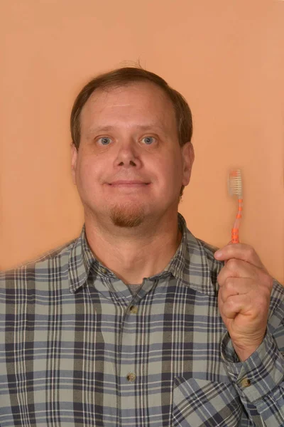 Hombre Con Una Camisa Cuadros Con Cepillo Dientes Mano Sobre —  Fotos de Stock