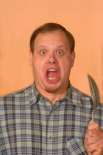 Man Plaid Shirt Orange Background Large Spoon Screams — Stock Photo, Image