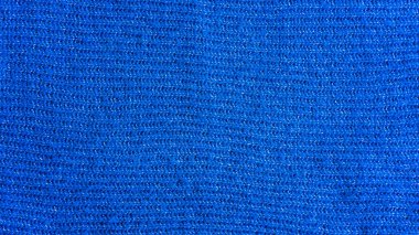 Kopyalama alanı ile örülmüş kusursuz bir arka plan. Noel veya kış tasarımı için mavi ve yeşil süveter deseni.