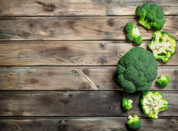 Pieces Fresh Broccoli Wooden Background — Stock Photo, Image
