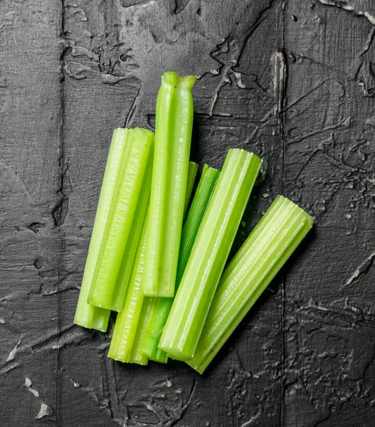 Pieces Fresh Celery Black Rustic Background — Stock Photo, Image
