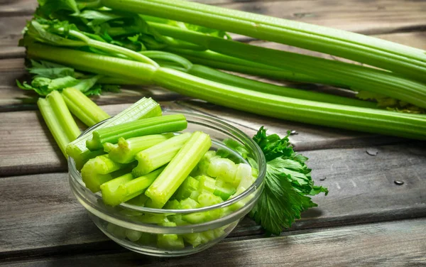 stock image Fresh sliced diced in a bowl. On wooden background