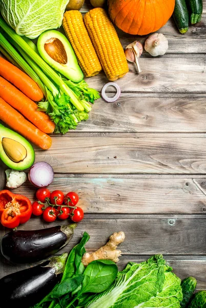 stock image Healthy food. Assortment of fresh organic fruits and vegetables. On a wooden background.